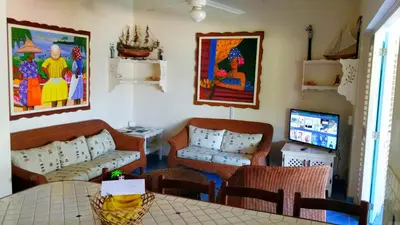a living room with a couch and a table at La Dolce Vita 12 Beachfront Hotels, Las Terrenas, Samana in Las Terrenas
