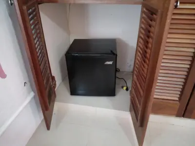 a small television sitting in the corner of a room at Apartamentos y habitaciones sol dominicus SOLO ADULTOS in La Laguna