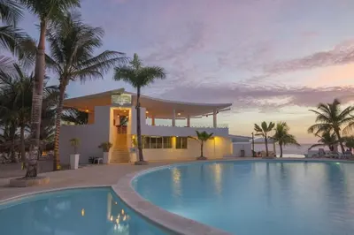 a large swimming pool in front of a resort at Apartamentos y habitaciones sol dominicus SOLO ADULTOS in La Laguna