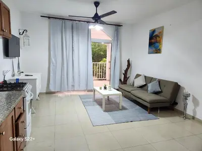 a living room with a couch and a table at Apartamentos y habitaciones sol dominicus SOLO ADULTOS in La Laguna