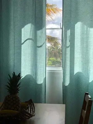 a pineapple sitting on a table in front of a window at Villa Florencia Vip in Punta Cana