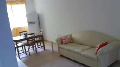 a living room with a couch and a table at Villa Florencia Vip in Punta Cana