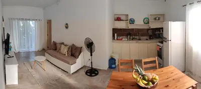 a living room with a couch and a table at Villa Florencia Vip in Punta Cana