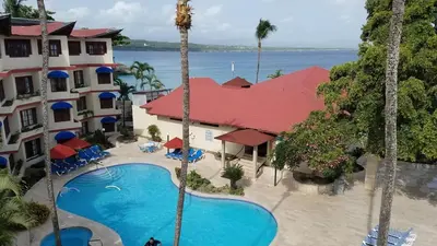 an aerial view of a resort with a swimming pool at Sosua by the Sea in Sosúa