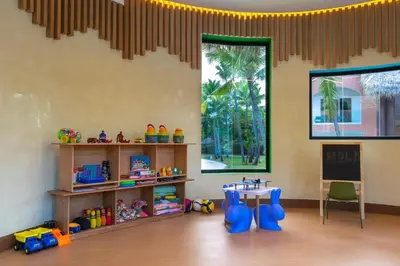 a room with a table and some toys in it at Tropical Deluxe Princess - All Inclusive in Punta Cana
