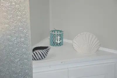 a shelf with two vases and a basket on it at Caribe Apartament S&D el castillo dominicus Apartamento #9 in Bayahibe