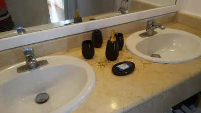 a bathroom counter with two sinks and a mirror at BUNGALOW 3111 OCEAN VIEW in Las Galeras