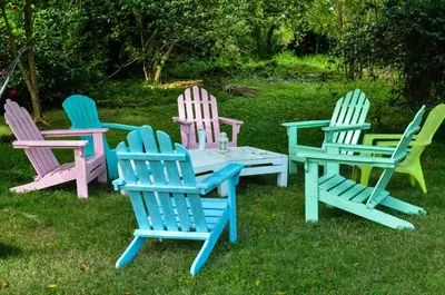 a group of chairs and a table in the grass at Campito Loving in Higuey