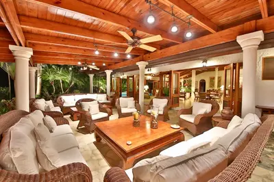 a living room with white furniture and a wooden ceiling at CASA NOSTRA RESORT by Klabhouse in La Romana