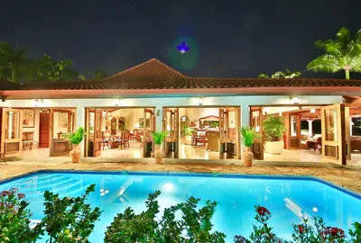 a house with a swimming pool in front of it at CASA NOSTRA RESORT by Klabhouse in La Romana