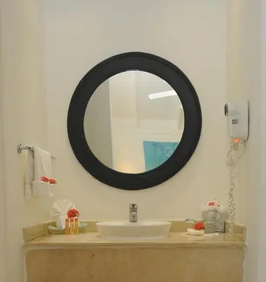 a bathroom with a sink and a mirror on the wall at Blue JackTar in San Felipe de Puerto Plata