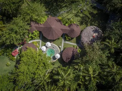 an overhead view of a resort with a pool and trees at Sublime Samana in Las Terrenas