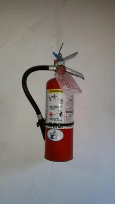 a fire hydrant with a tag on top of it at Hotel Riparbella in Santo Domingo