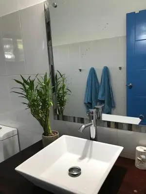 a white sink in a bathroom with a mirror at Villa Luce in Las Terrenas
