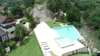 an aerial view of a house with a swimming pool at Ximenoa Rivers Villa Relax in Jarabacoa