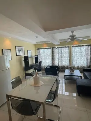 a living room with a couch and a table at City Caribbean Hotel Boutique in Santo Domingo