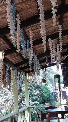a bunch of beads hanging from a ceiling at La famosa costillas a la leña in Jarabacoa