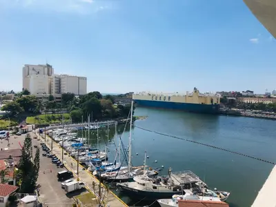 a group of boats docked in a marina at Estancia Riviera Colonial I in Santo Domingo
