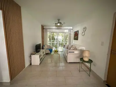 a living room with a couch and a tv at Beautiful & Comfortable Apartment near Colonial Zone in Santo Domingo