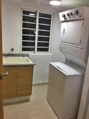 a kitchen with a white stove and a sink at Beautiful & Comfortable Apartment near Colonial Zone in Santo Domingo
