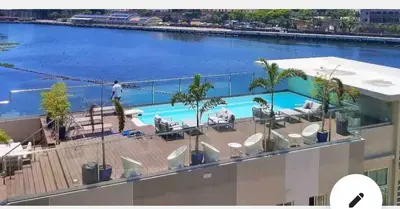 a view of a swimming pool from the roof of a building at Beautiful & Comfortable Apartment near Colonial Zone in Santo Domingo