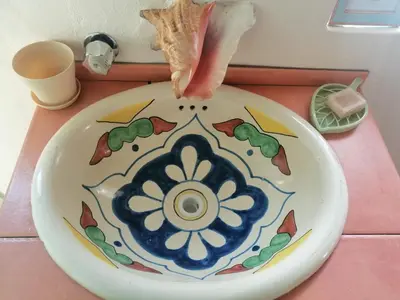 a person eating a piece of food on a plate at GuaiGüí Bayahibe in Bayahibe
