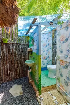 a bathroom with a sink and a toilet at GuaiGüí Bayahibe in Bayahibe