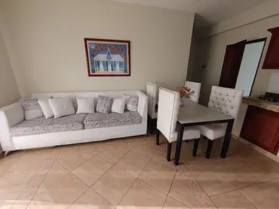 a living room with a couch and a table at Residence Meridiana in Juan Dolio