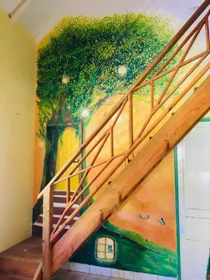 a painting of a staircase with a mural at Labellaventura in Las Galeras