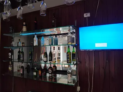 a bar with a display of bottles of wine at Micro Hotel Condo Suites in Santo Domingo