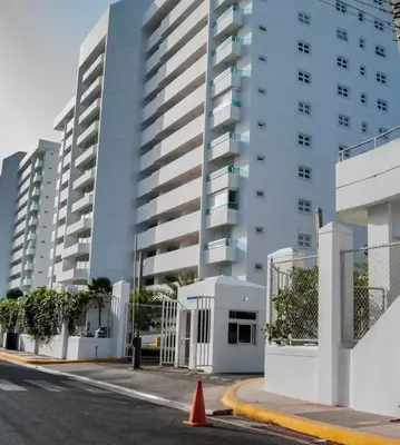 an empty street in front of a tall building at Beach Apartment - Marbella, Juan Dolio!! Getaway Offer!! in Juan Dolio