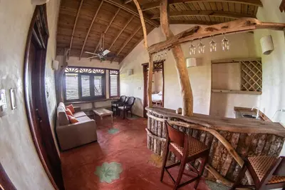 a living room with a bar in a house at Paraiso Caño Hondo in Los Guineos Perdidos