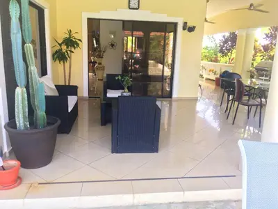 a lobby with a cactus and a table and chairs at Elegant Villa with Sea View in Sosúa | Private Pool in Sosúa