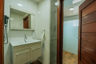 a bathroom with a sink and a shower at Hotel Checkin El Cortecito in Punta Cana