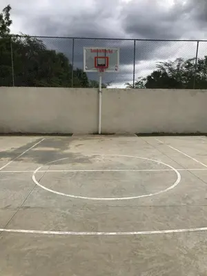 an empty basketball court with a hoop at CONFORTABLE first floor en santiago RD in Santiago de los Caballeros
