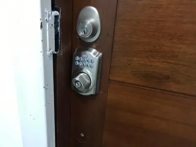 a close up of a wooden door with a knob at moderno apto frente a la piscina in Santiago de los Caballeros