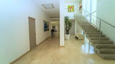 a hallway with a staircase in a house at Cap el Limon Luxury Villas in El Limón