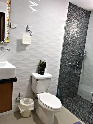 a bathroom with a toilet and a shower at Fully Equipped New 1br Apt dt 2mins To Beach in Sosúa