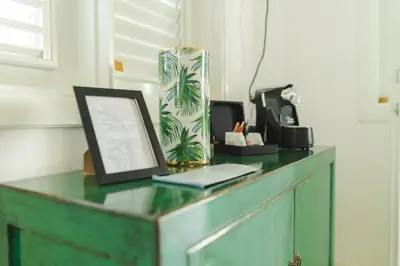a desk with a laptop on top of it at PUNTA POPY BOUTIQUE HOTEL - Adults Only in Las Terrenas
