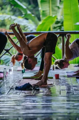 a group of people doing yoga on the ground at Dominican Tree House Village in El Valle
