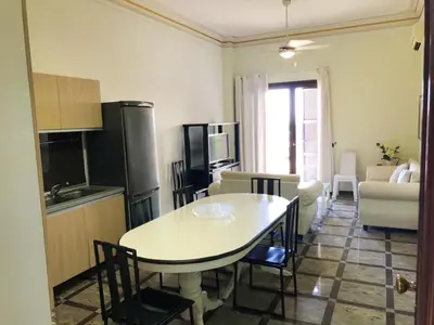 a kitchen and living room with a table and a kitchen and a living room at Sea View Apartment in Boca Chica, 50 m², Air Conditioning in Boca Chica