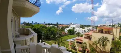 a view of a city from the balcony of a building at Sea View Apartment in Boca Chica, 50 m², Air Conditioning in Boca Chica