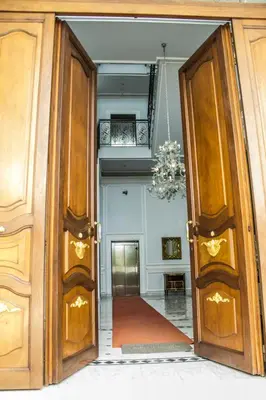 an open door to a room with a chandelier at Modern Apartment in Boca Chica, 130 m², Air Conditioning Included in Boca Chica