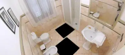 a bathroom with a toilet and a sink at Modern Apartment in Boca Chica, 130 m², Air Conditioning Included in Boca Chica