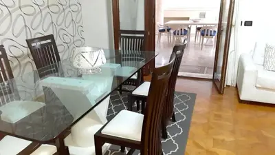 a dining room with a glass table and chairs at Elegant apartment with Jacuzzi in Boca Chica - 200 m² in Boca Chica