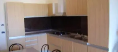 a kitchen with two chairs and a counter top at Modern apartment in Boca Chica – 75 m² with air conditioning in Boca Chica