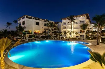 a large blue swimming pool in front of a building at Espectacular Apartamento con Vista al Mar Solo Adultos in La Laguna