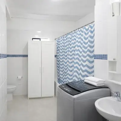 a white bathroom with a sink and a toilet at Espectacular Apartamento con Vista al Mar Solo Adultos in La Laguna