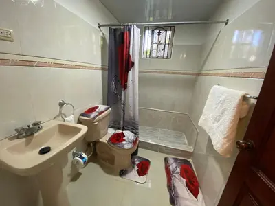 a small bathroom with a sink and a toilet at Santo Domingo Paradise V - #211 in La Estrella