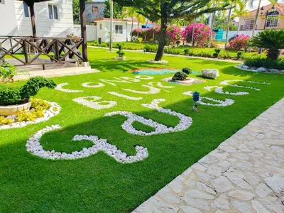 a peace sign in the grass in a park at Luxury in the Caribbean in Sosúa